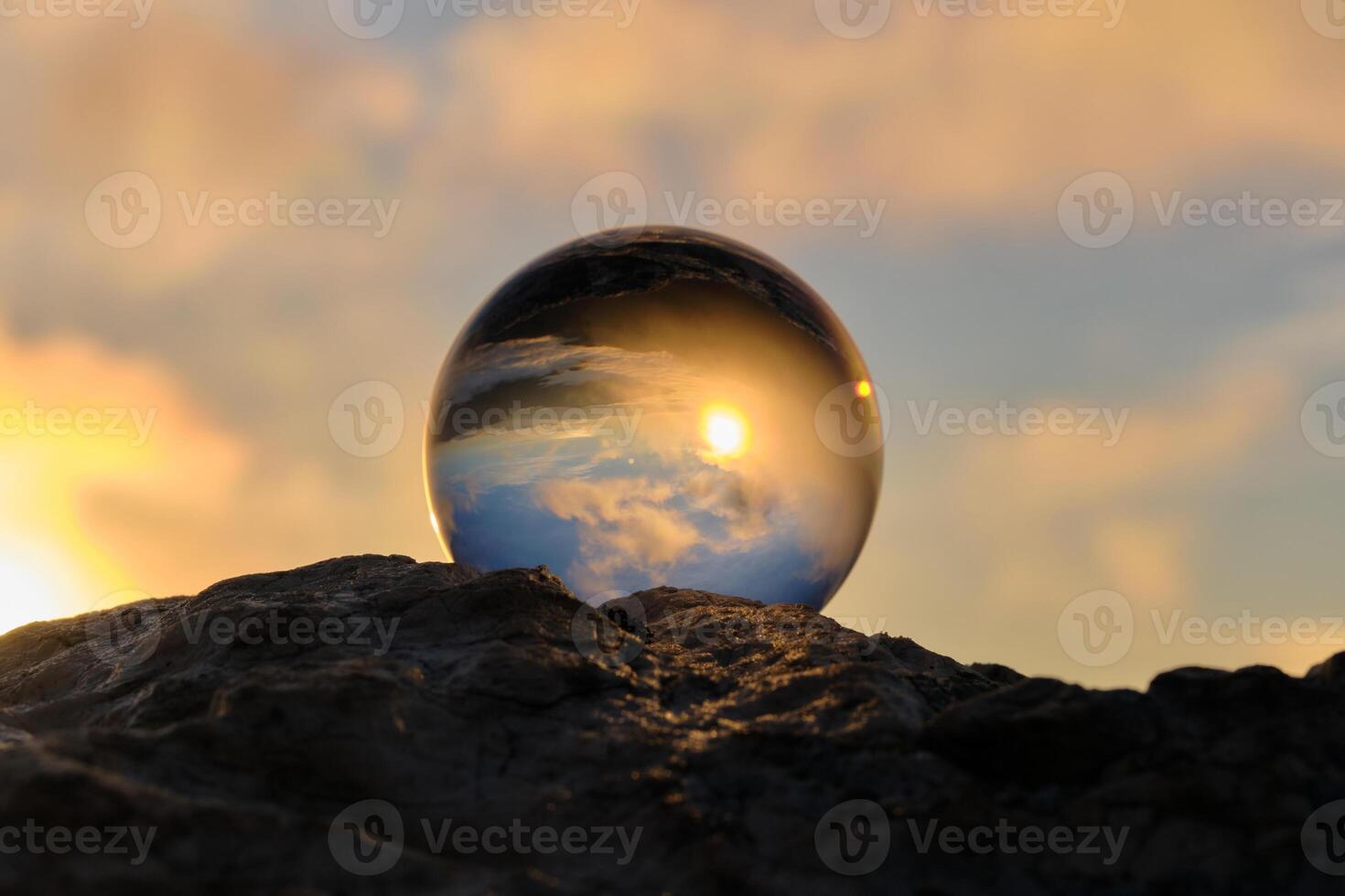 The landscape view on a nature through a glass ball with a blurred background creative photography photo