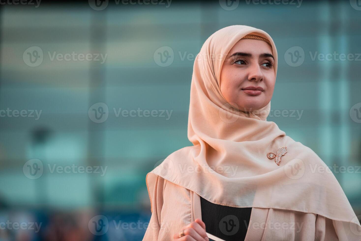 Portrait of a confident Muslim business woman in hijab near the office building. photo