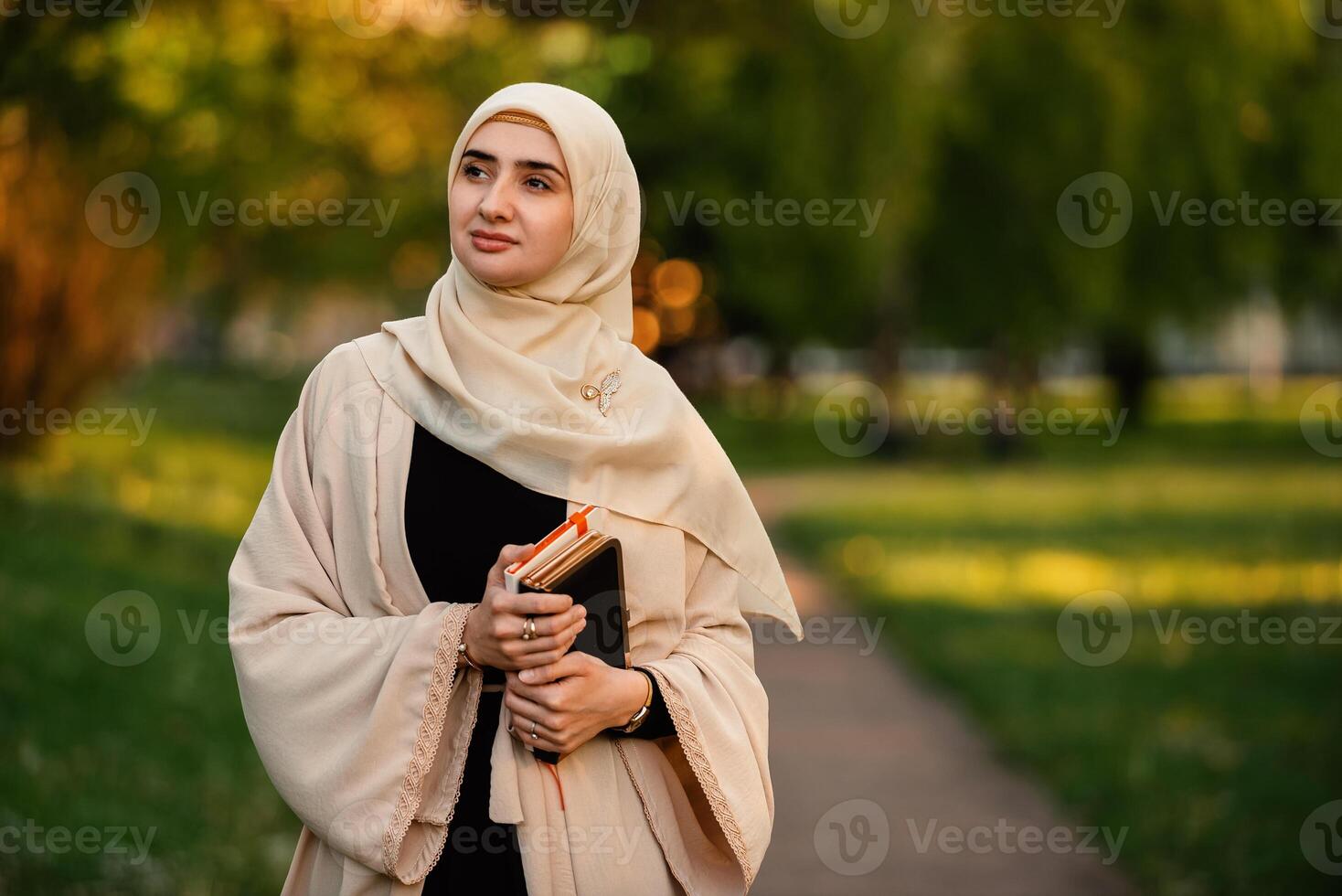 Portrait of a confident Muslim woman in hijab outdoor. photo