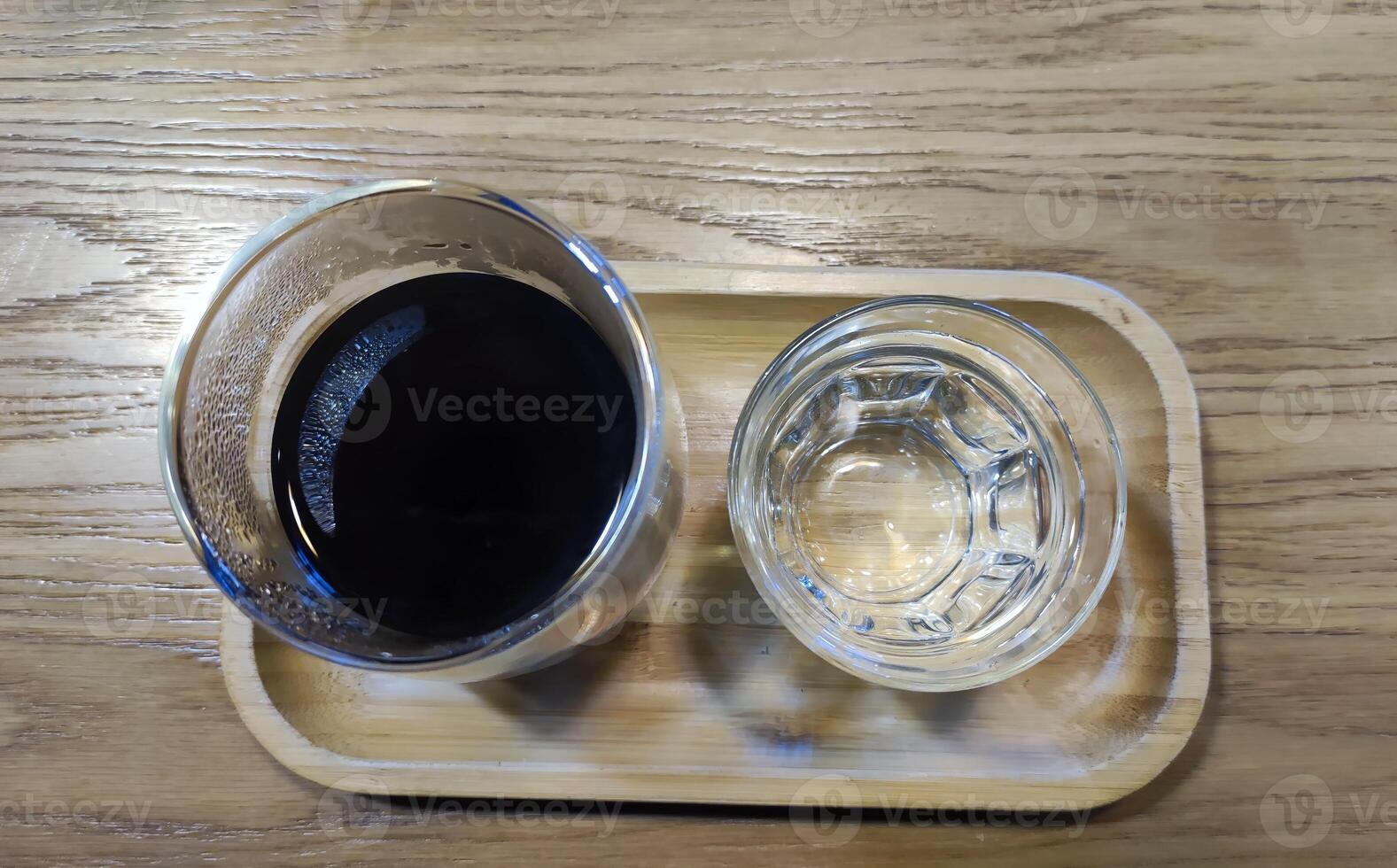 Coffee and water background, black coffee and a glass of water photo