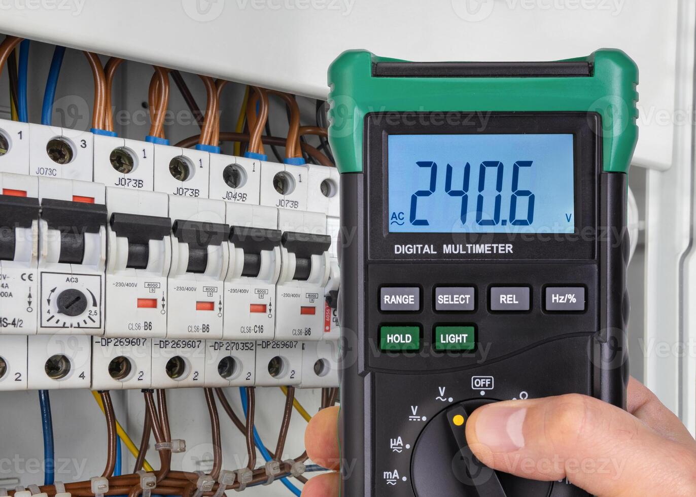 Digital Multimeter Reading Voltage in Electrical Panel photo