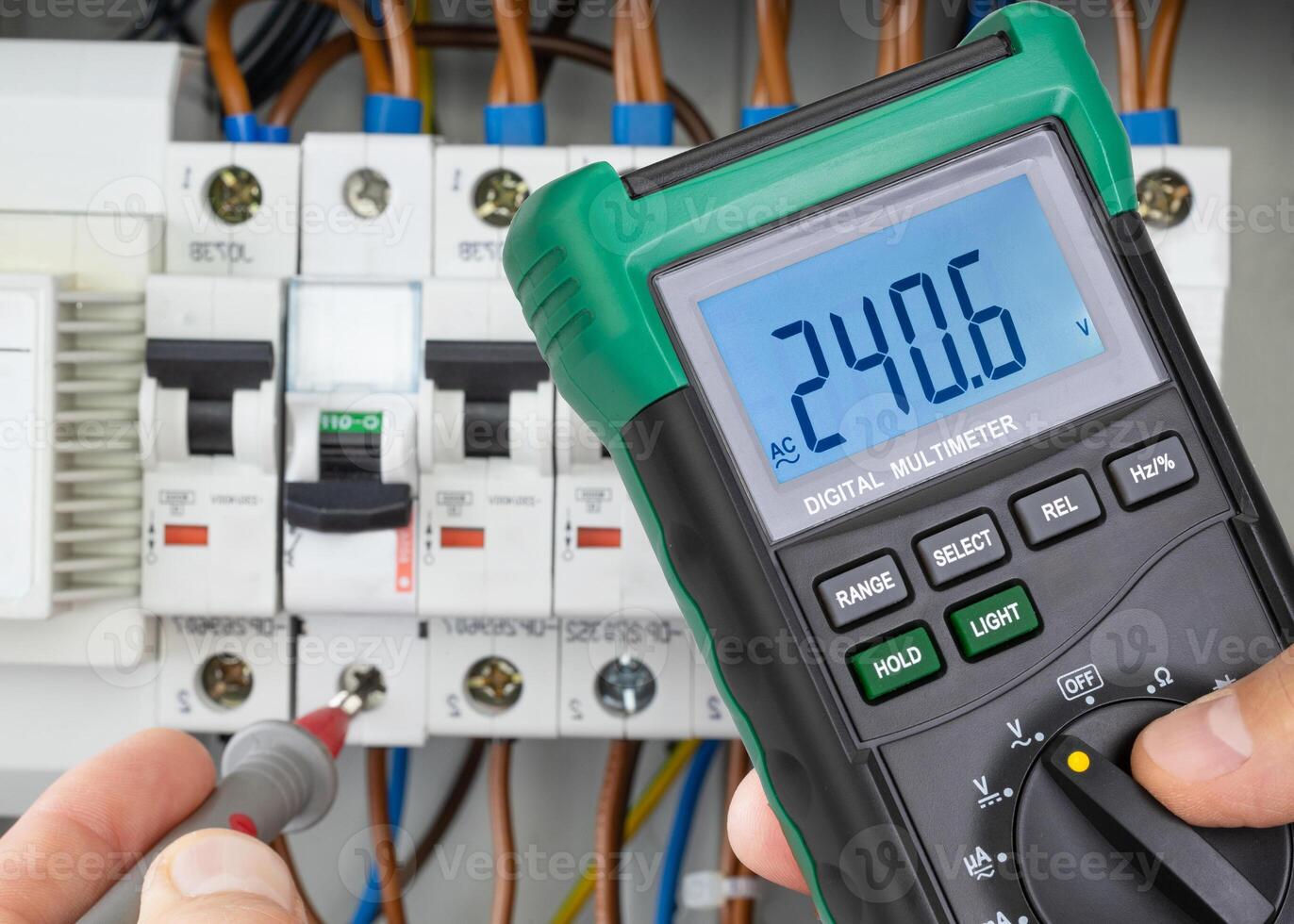 Voltage Measurement in Circuit Breaker Panel with Digital Multimeter photo
