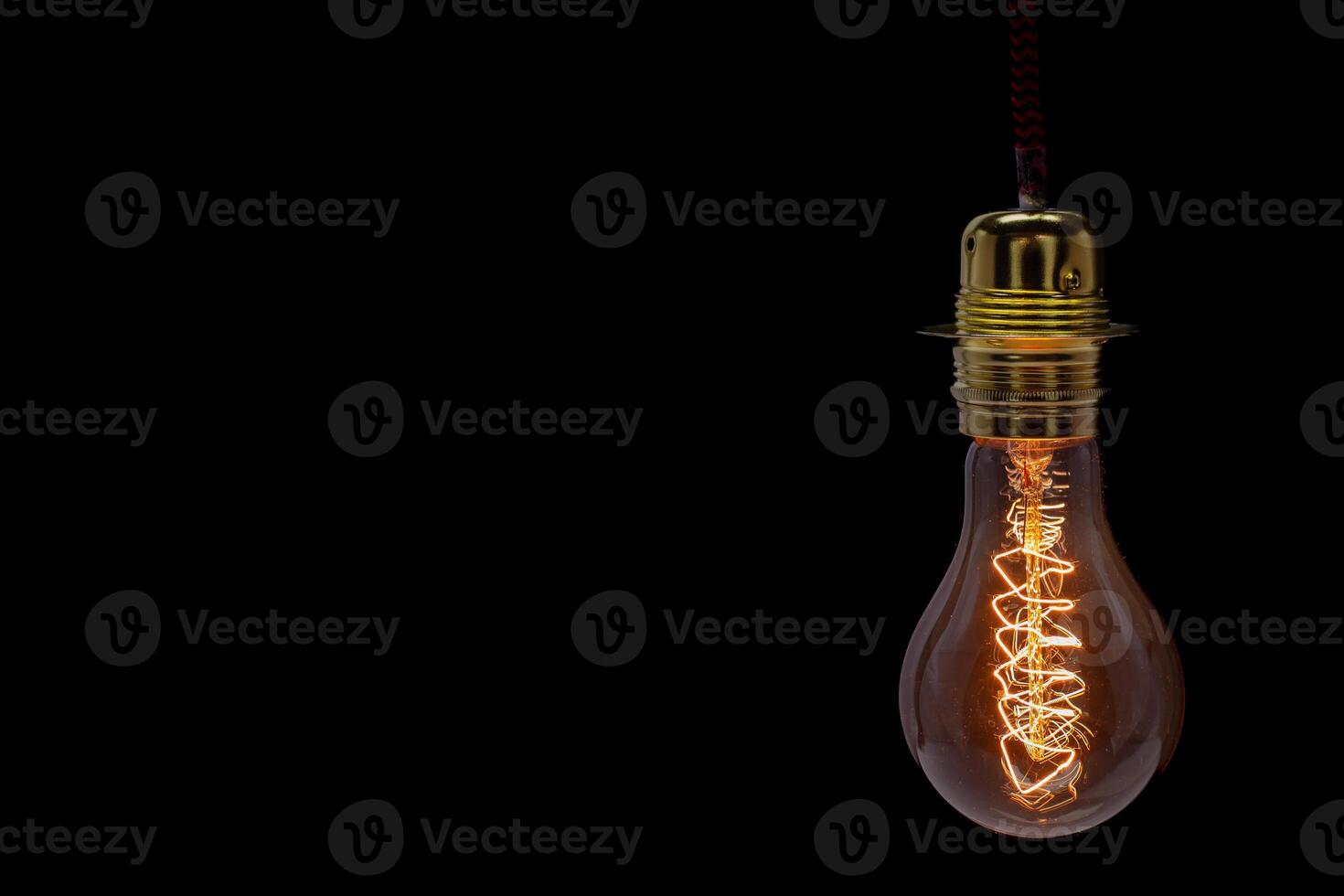 Vintage Edison Light Bulb with Glowing Filament. Copyspace photo