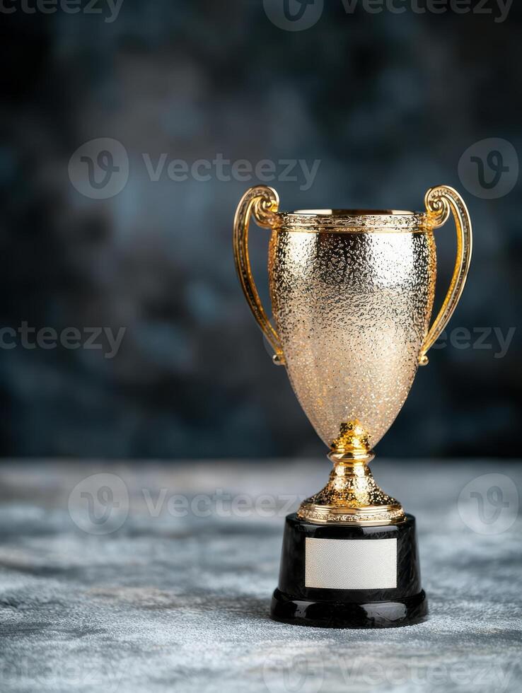 golden trophy award on dark background photo