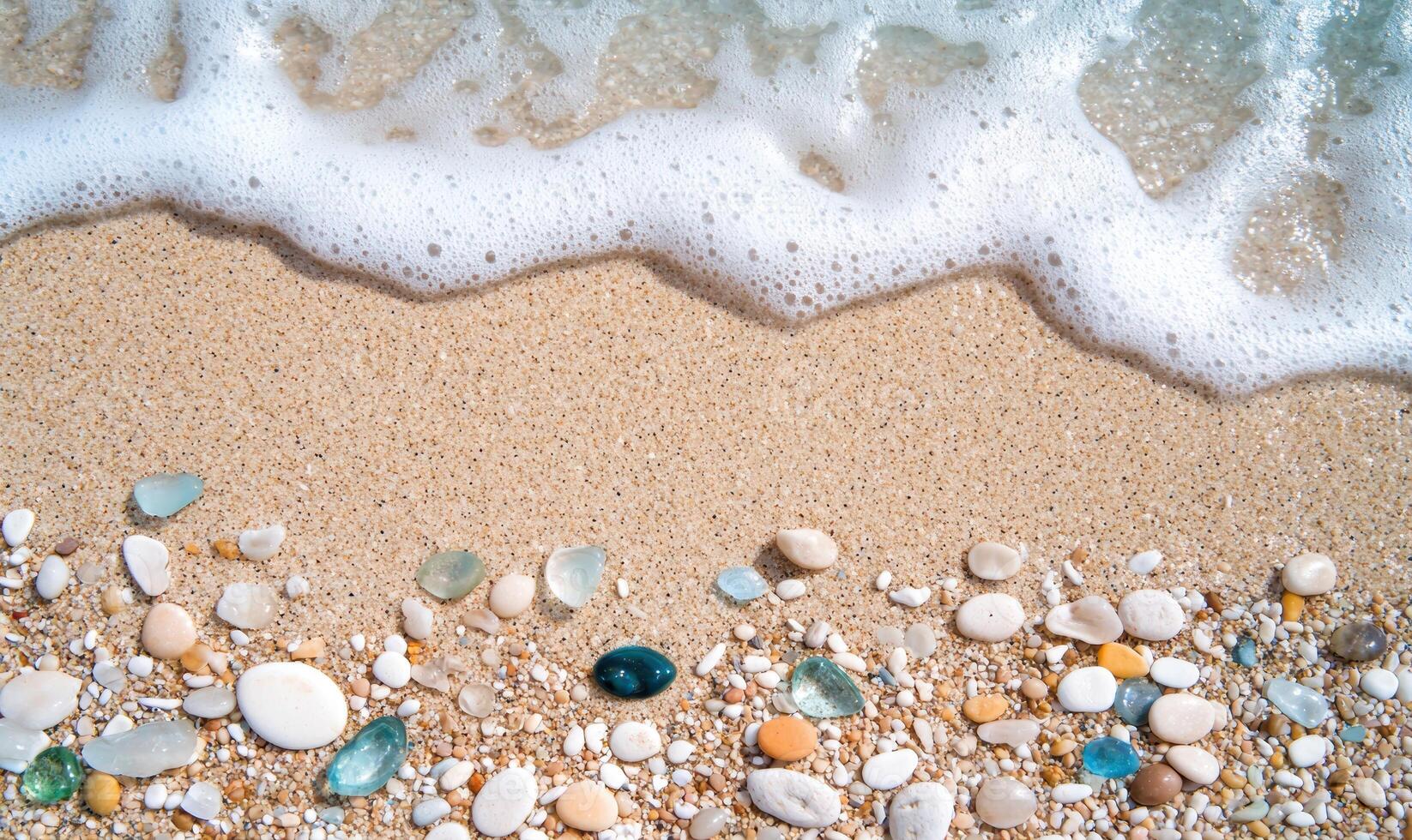 Tranquil beach scene with sand, stones, and waves photo