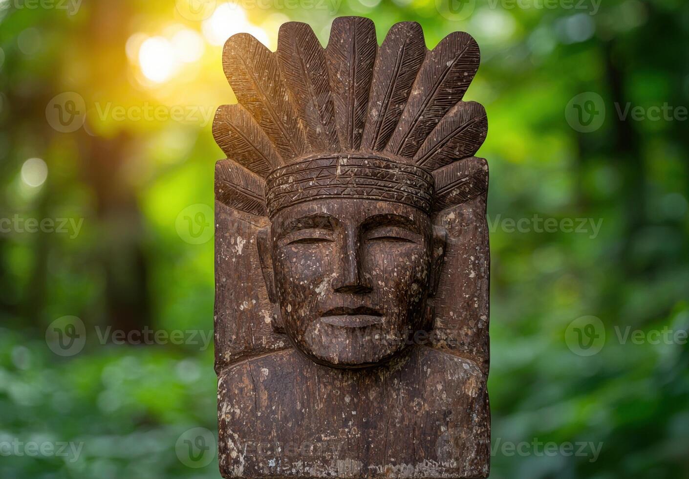 Weathered wooden tribal mask with feathered headdress photo