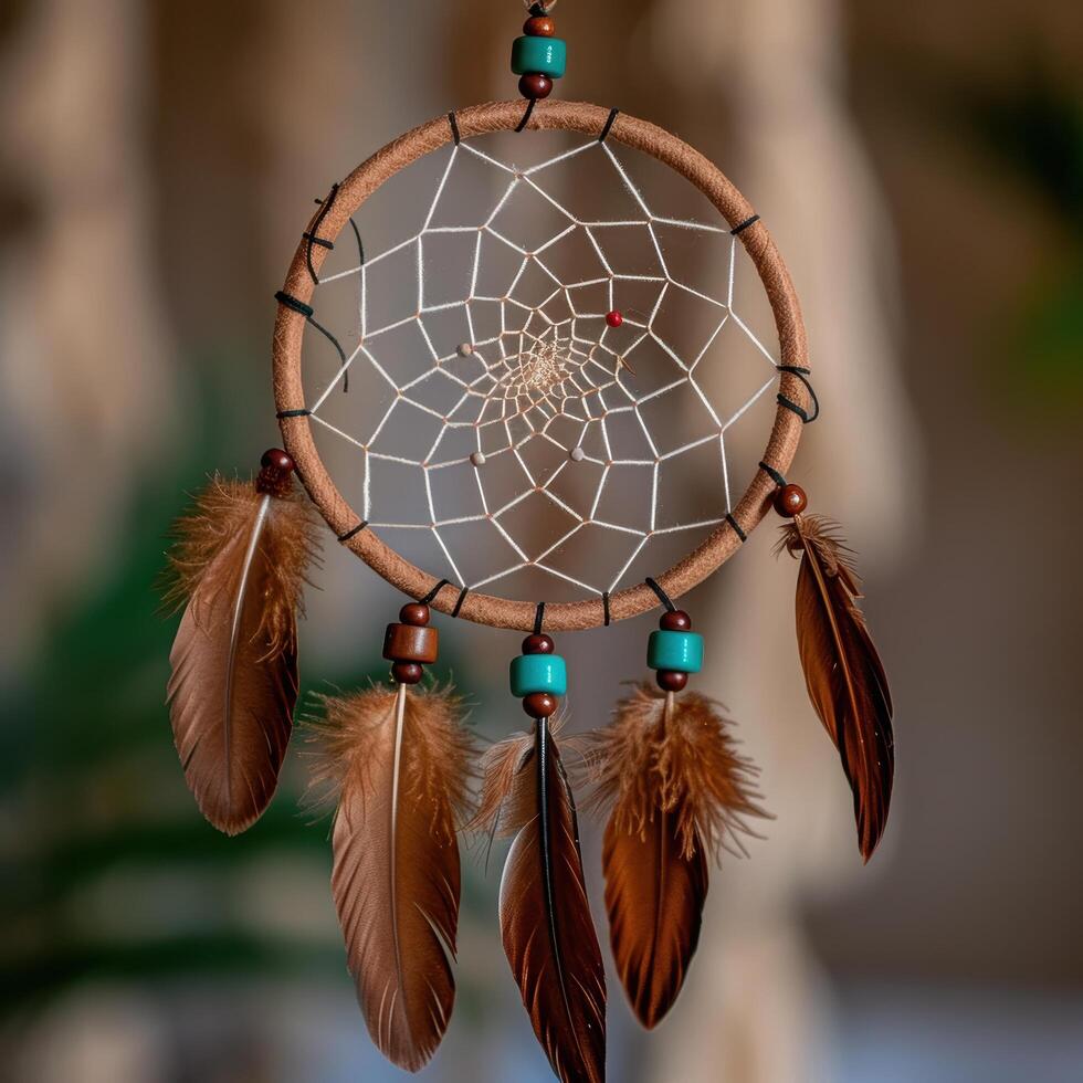 Intricate dreamcatcher with feathers and beads photo