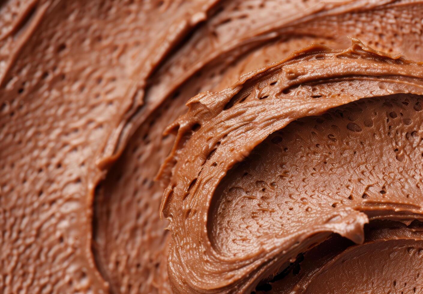 Closeup of rich chocolate frosting texture photo