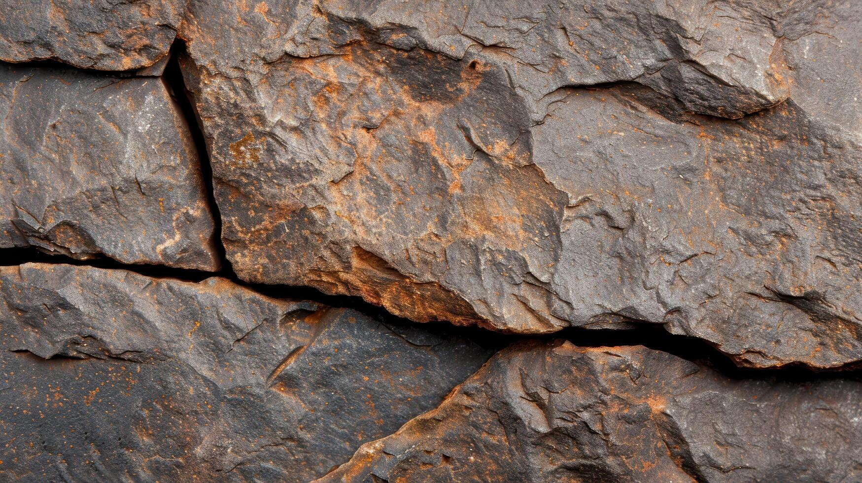 Rugged rock texture with natural patterns and cracks photo