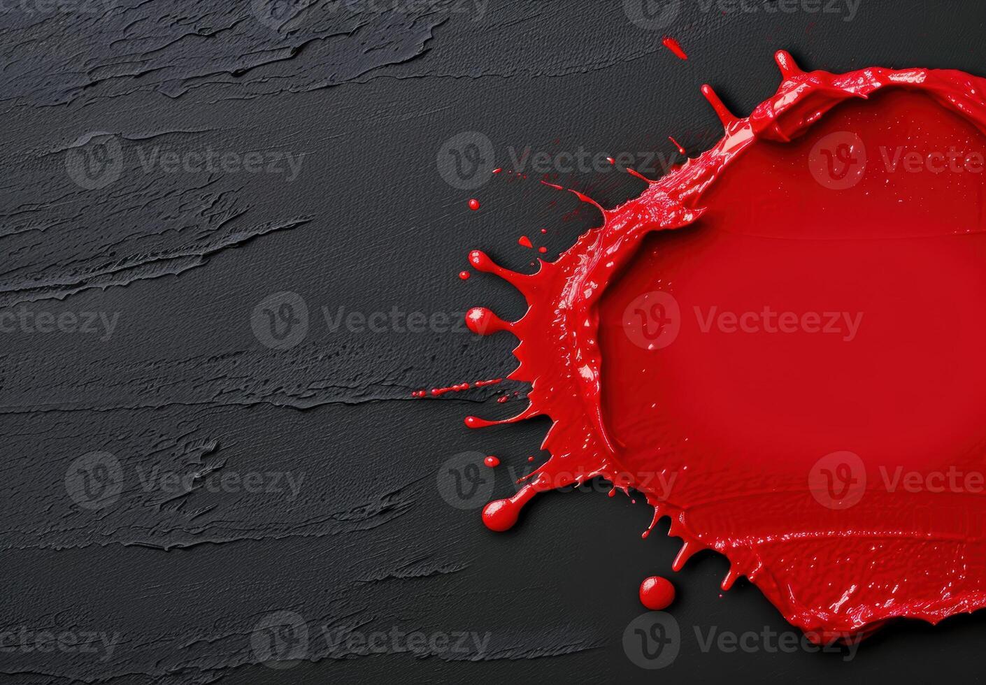 Vibrant red paint splash on dark background photo
