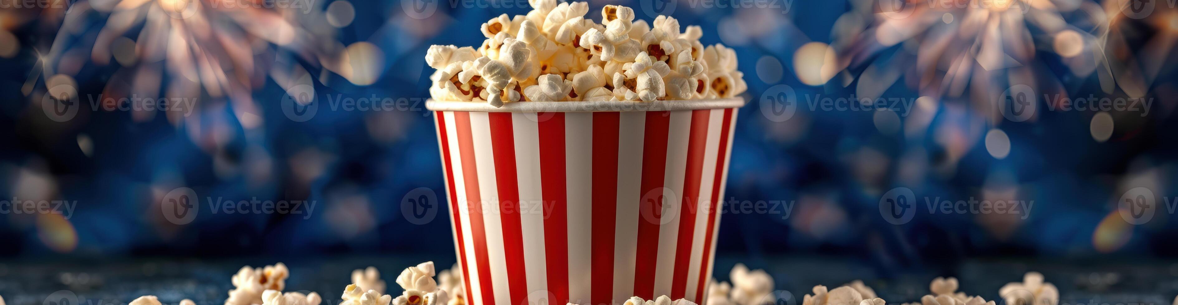 Popcorn in a striped bucket with fireworks in the background photo