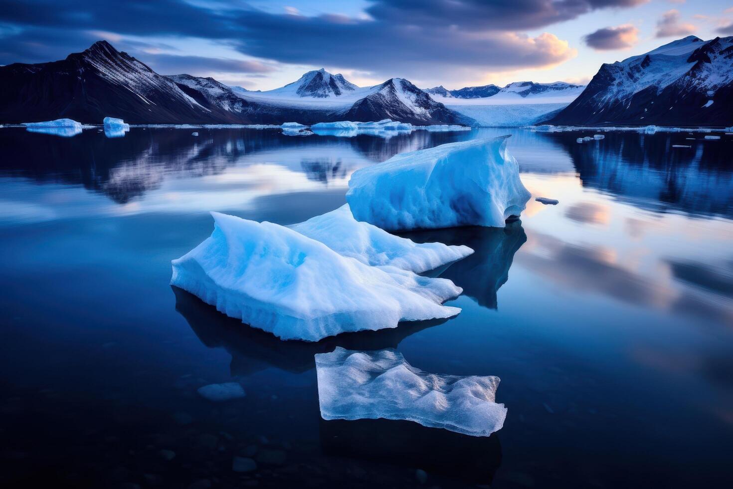 Serene arctic landscape with icy mountains and reflective lake photo