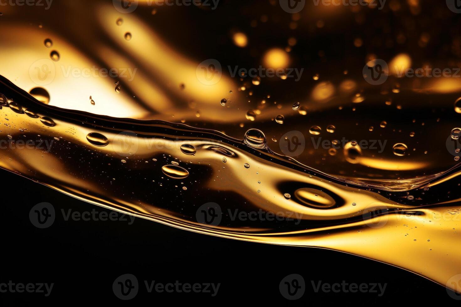 Closeup of golden liquid with bubbles and droplets photo