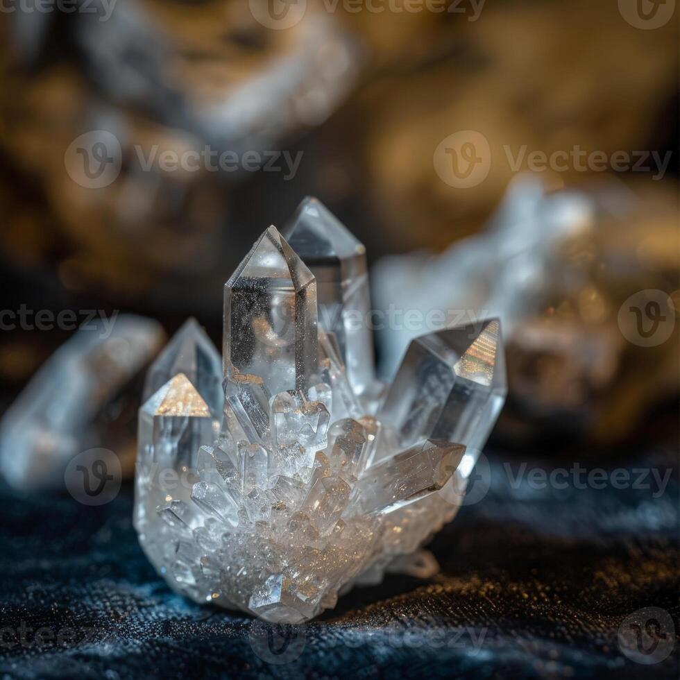 Sparkling crystal quartz cluster on dark fabric photo