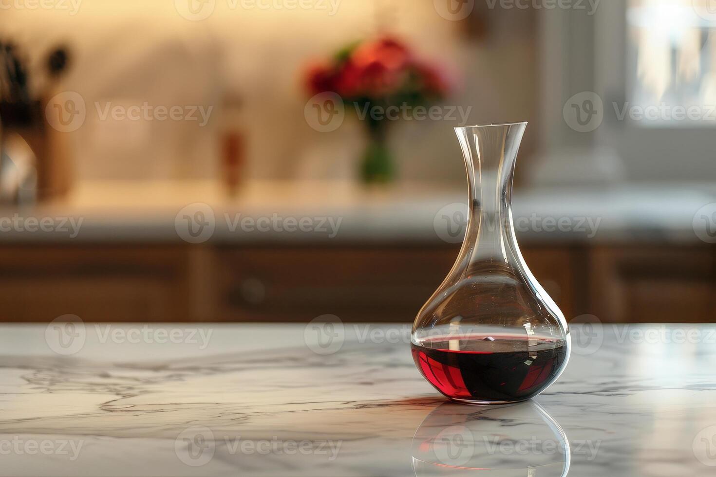 elegant glass decanter with red wine on marble table photo