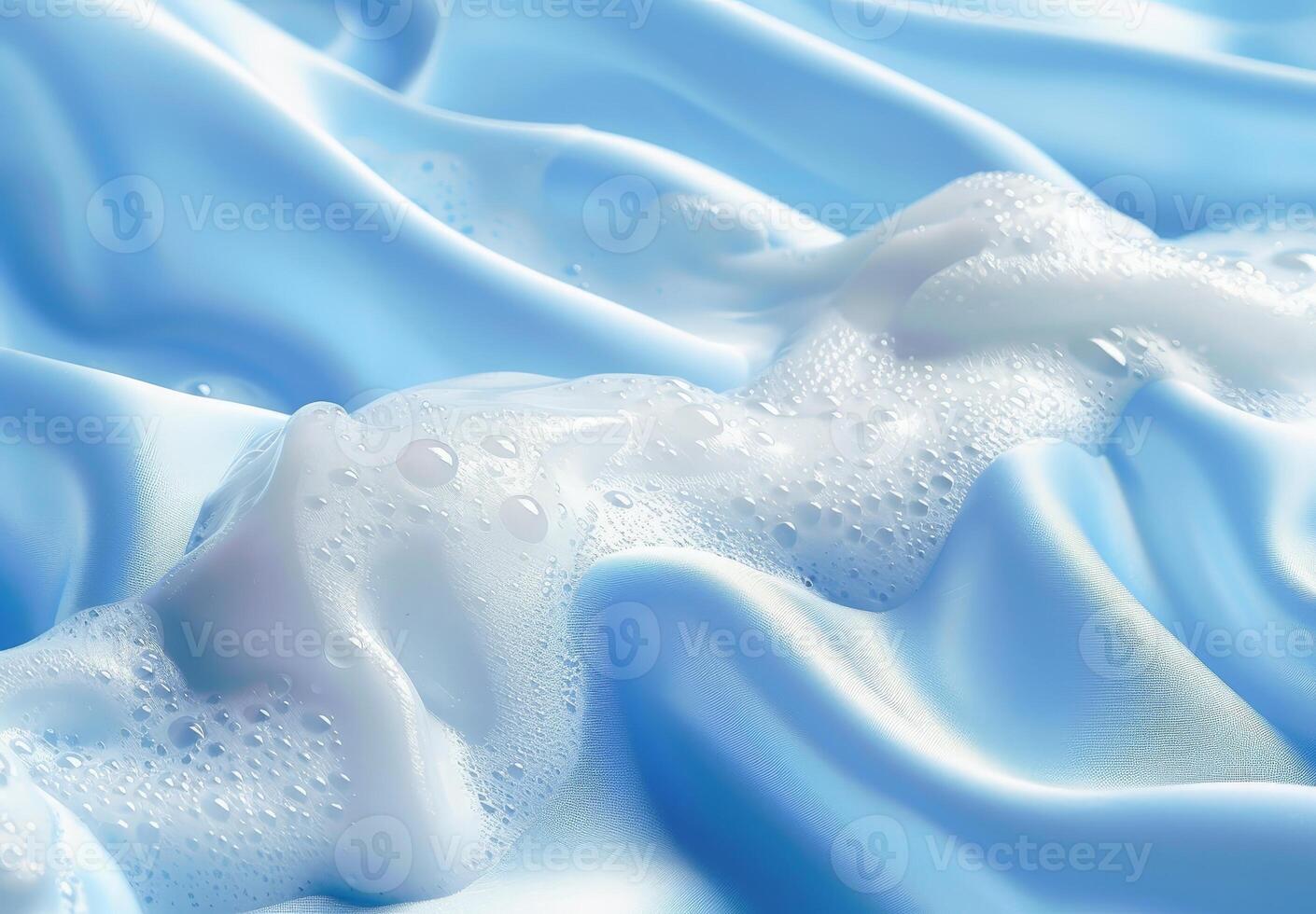 Frozen water droplets on a blue fabric photo