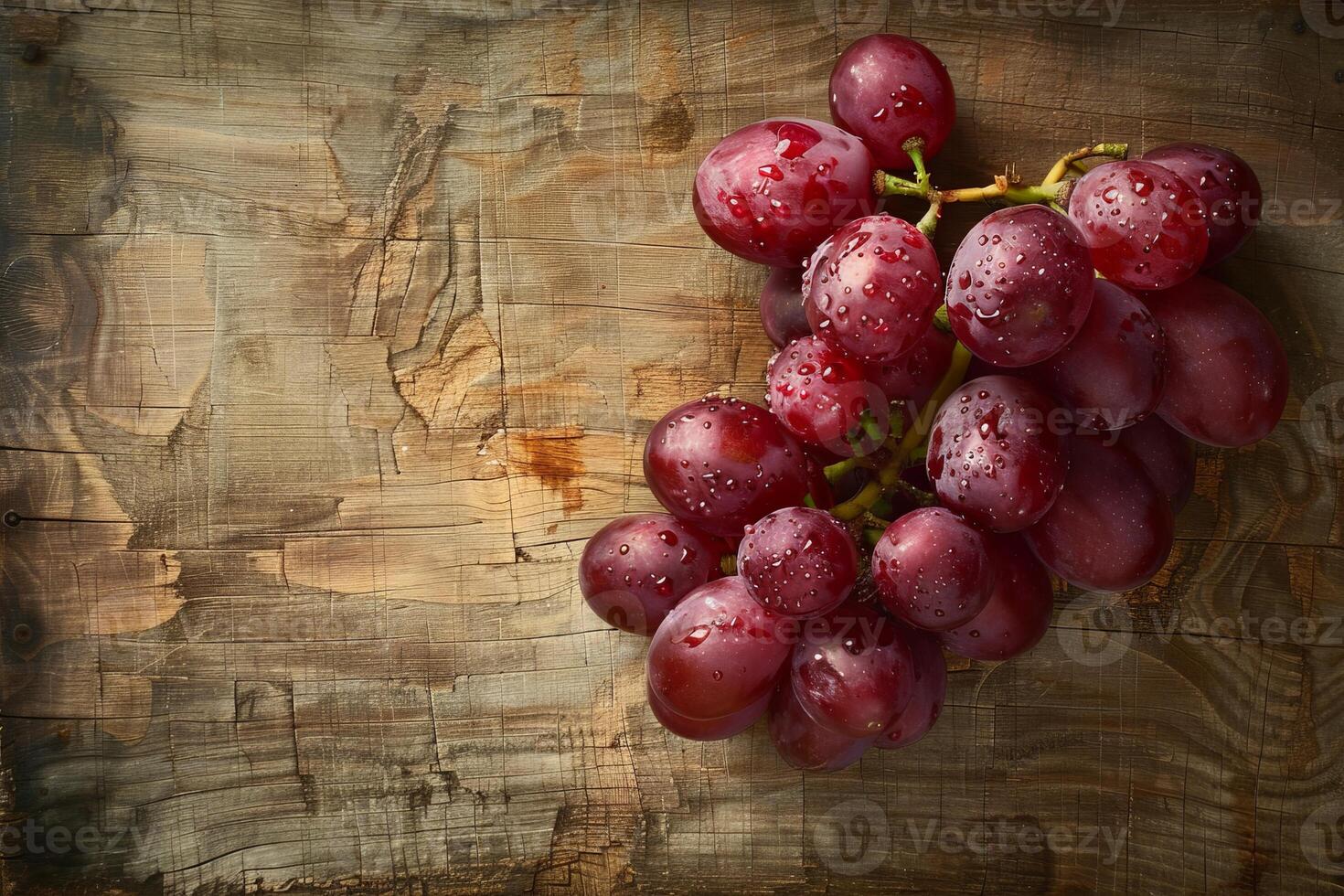 Ripe red grapes on a rustic wooden surface photo