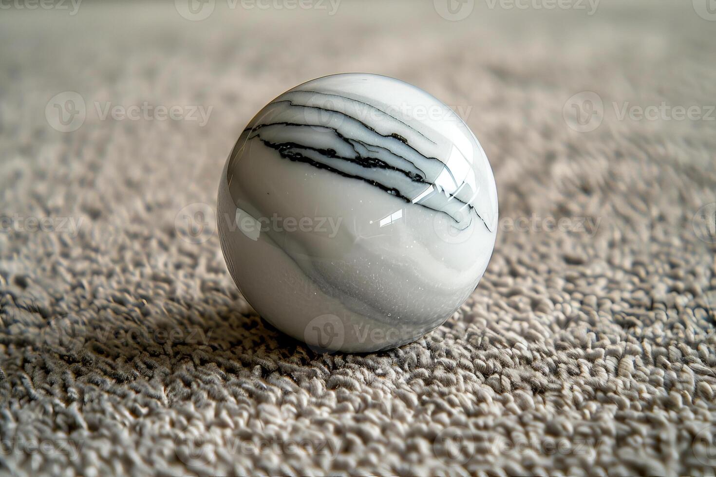 Marble sphere on plush carpet photo