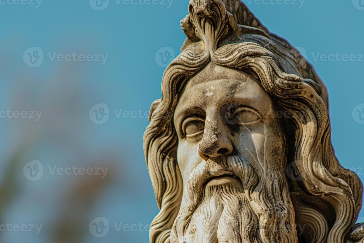 Weathered stone statue with intricate details photo