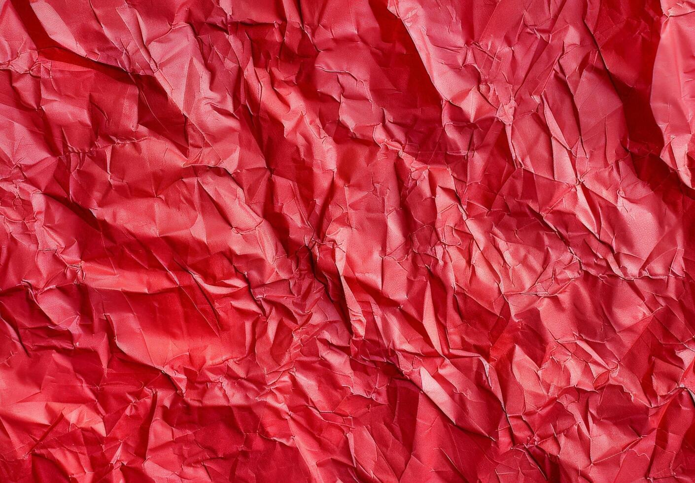 Crumpled red paper texture background photo