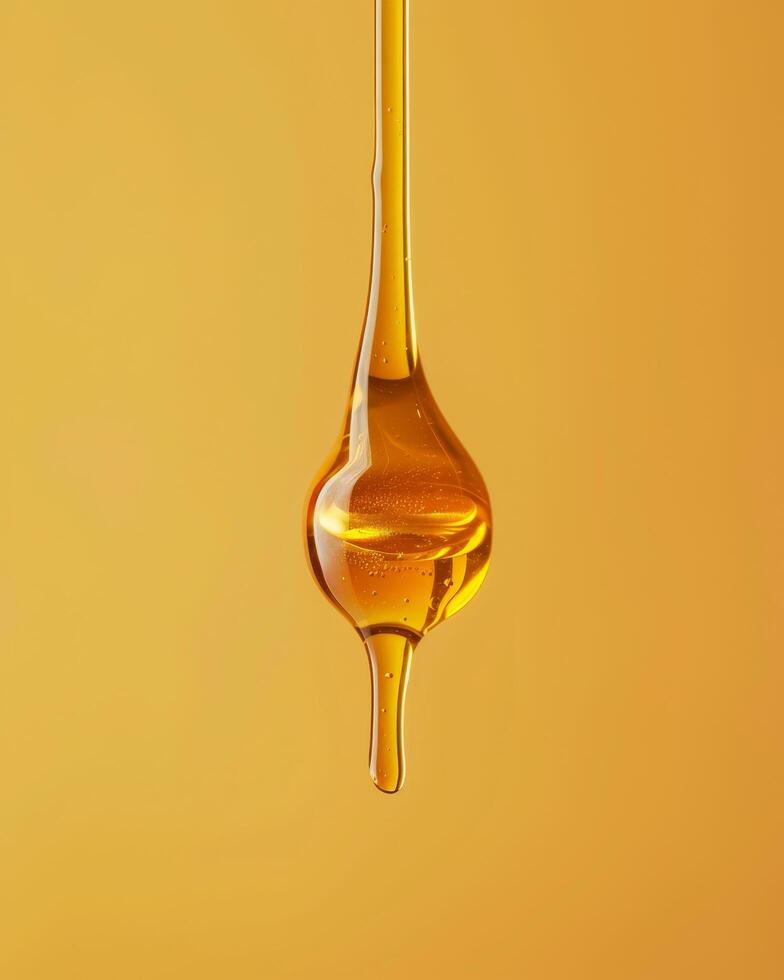 Close up of golden honey dripping from a spoon photo