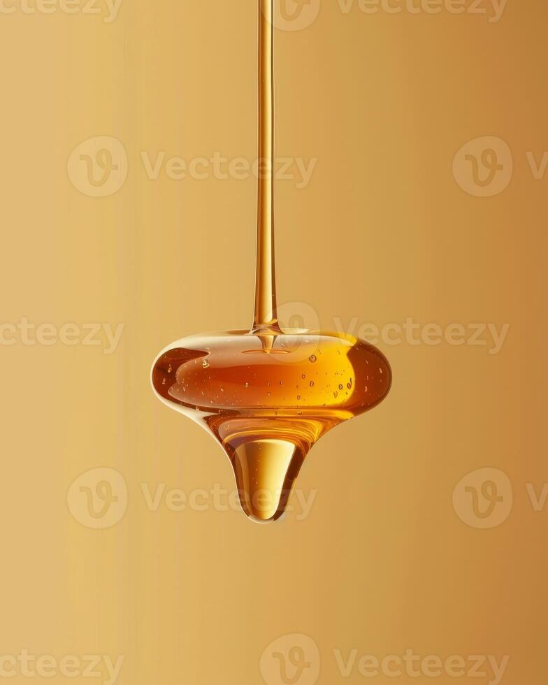 Flowing golden honey dripping from a spoon photo