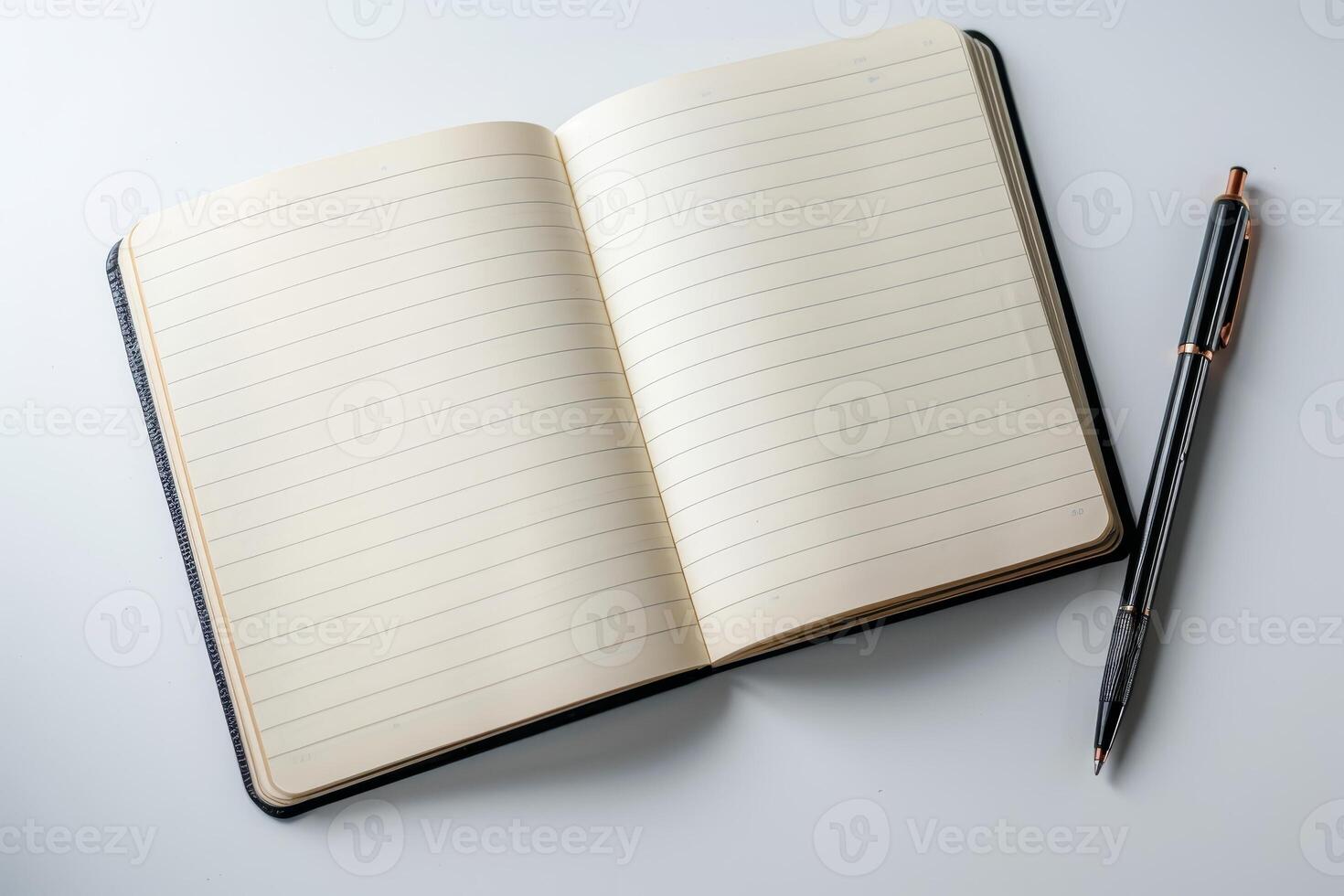 open notebook with blank pages and pen on white background photo