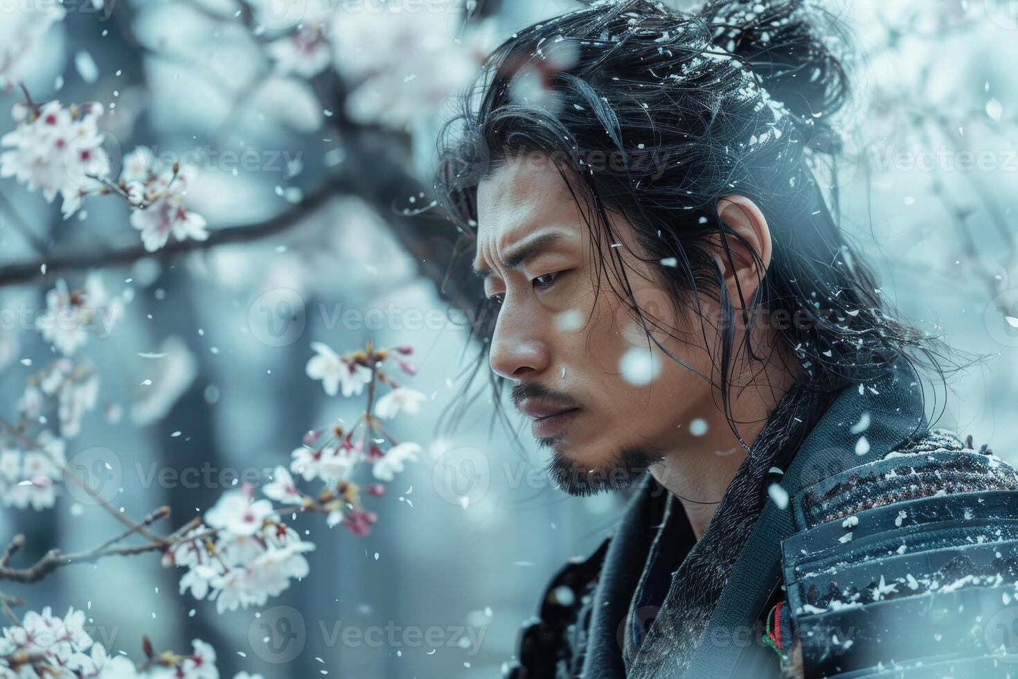 Pensive man in snowy forest photo