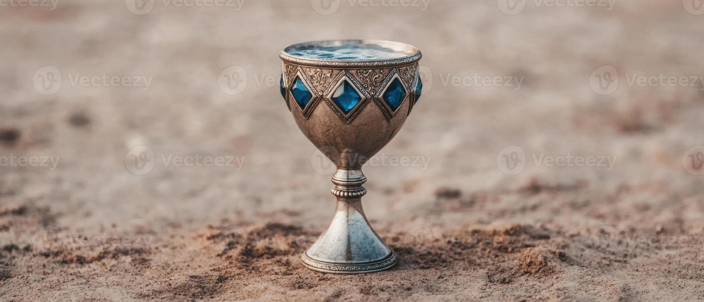 Ornate antique chalice with blue gemstones photo