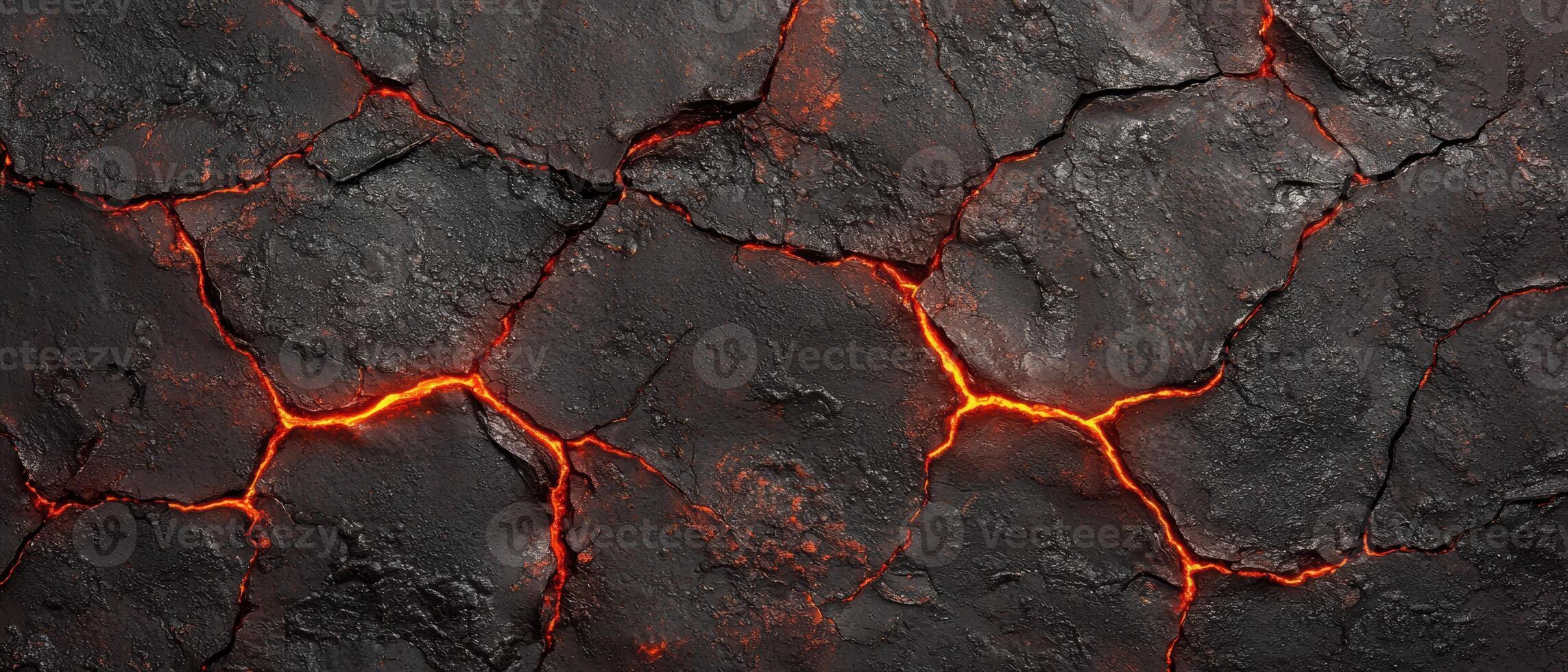 Cracked volcanic rock with glowing lava photo