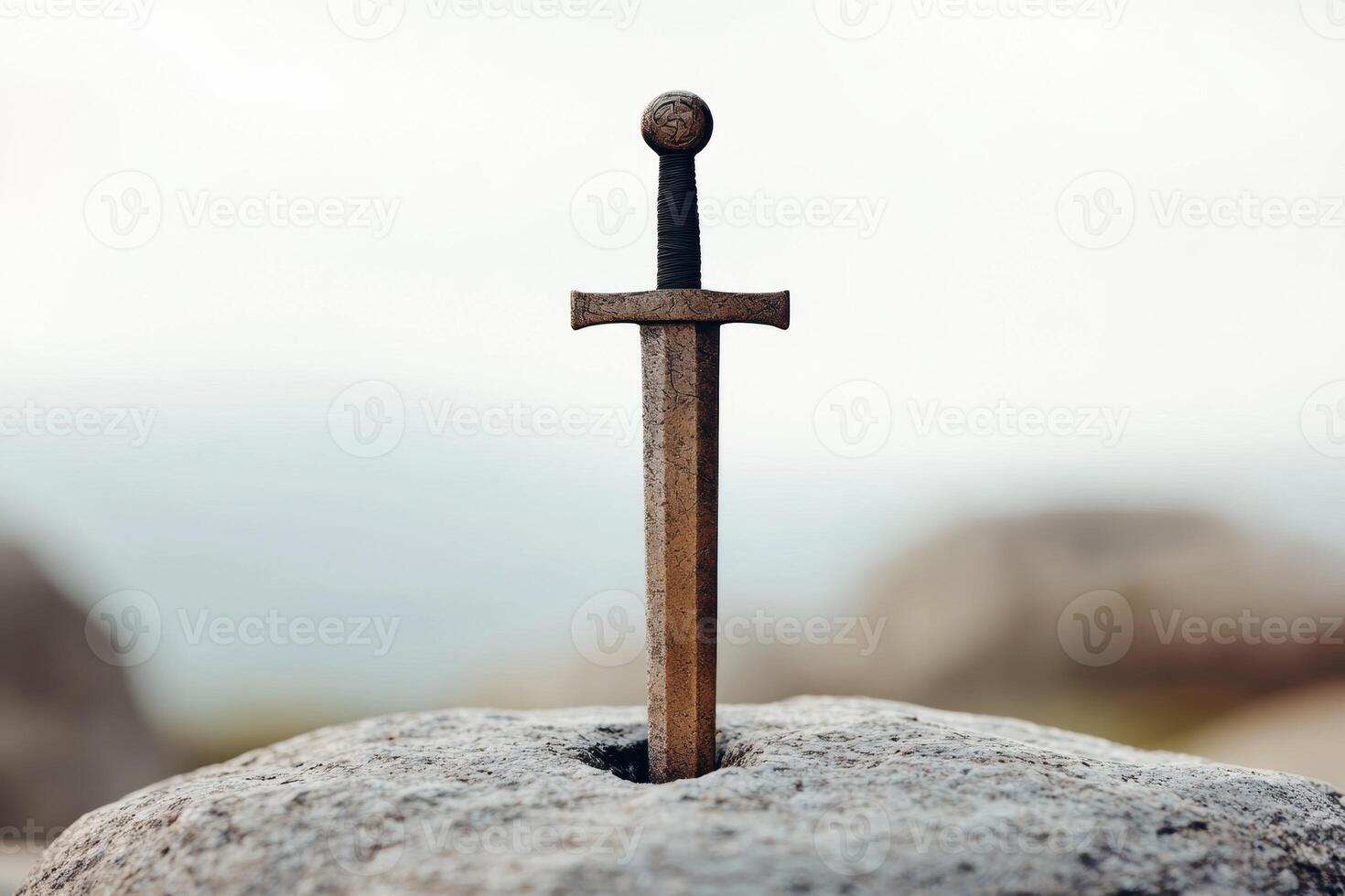 ancient sword embedded in stone photo