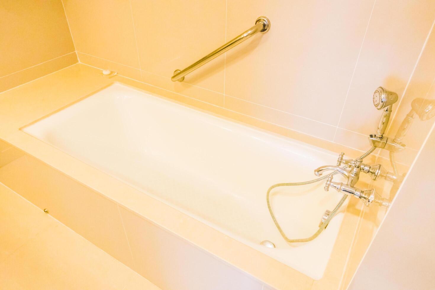 A bathroom with a bathtub and a shower photo