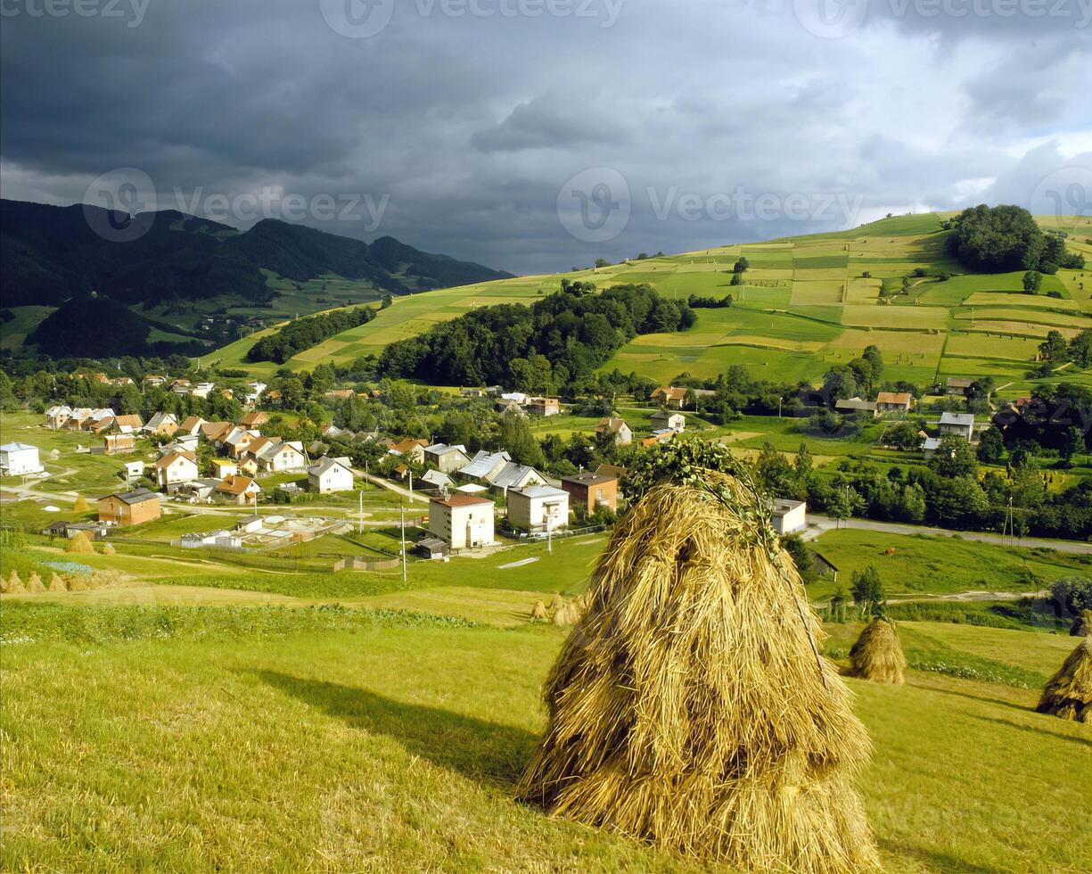 Breathtaking Highland Landscape. People Enjoying Nature with Mountains, Trees, and Clouds photo