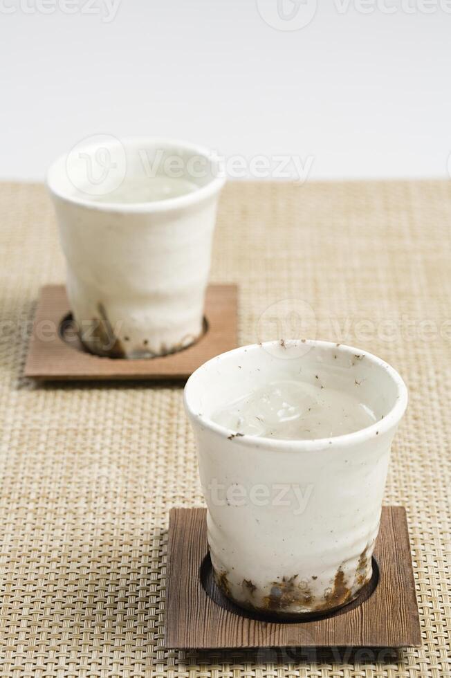 Cups on coasters photo