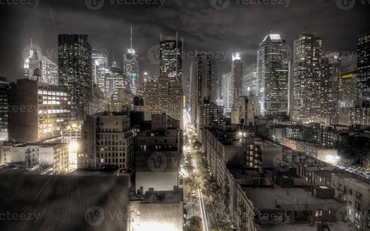 Modern Skyscraper Towering Against a Cloudy Sky in an Urban Landscape photo