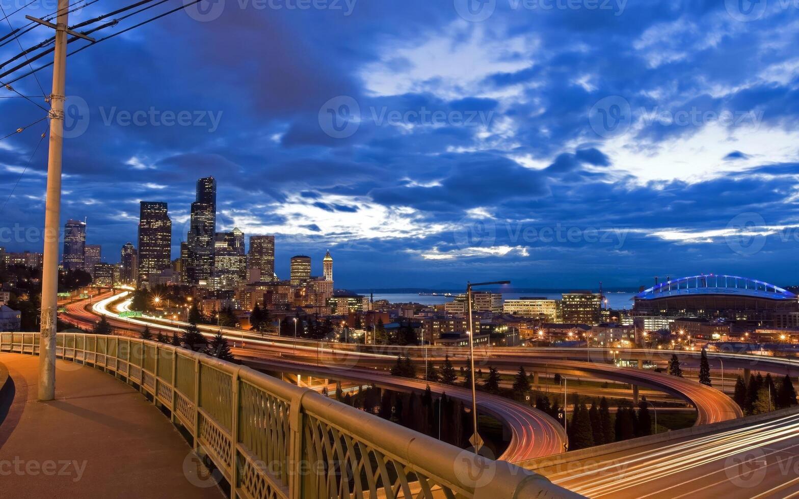 Urban Skyline at Dusk. A Towering Cityscape Against a Cloudy Sky photo