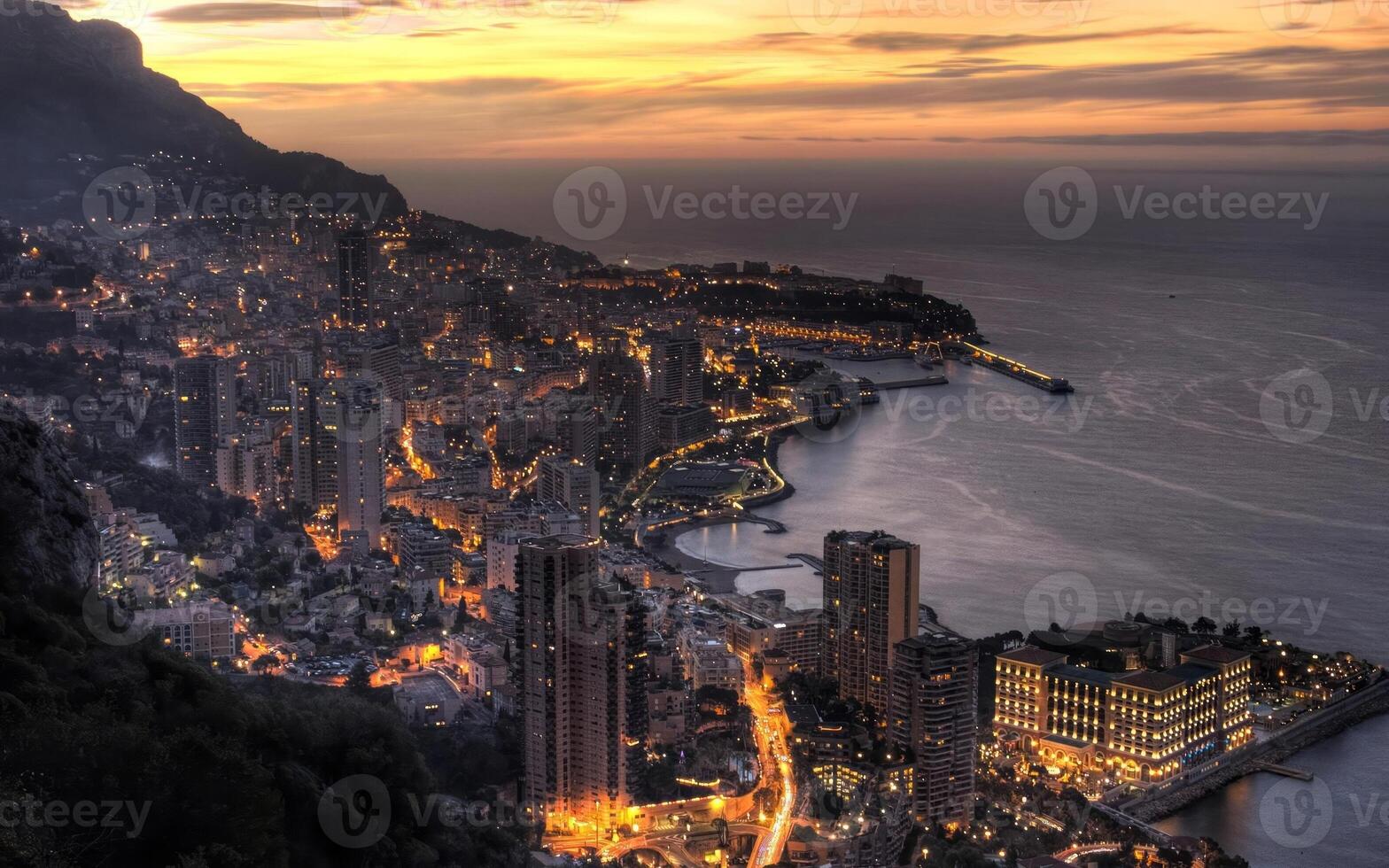 Serene Dusk Over Mountains and Buildings Beneath a Cloudy Sky photo