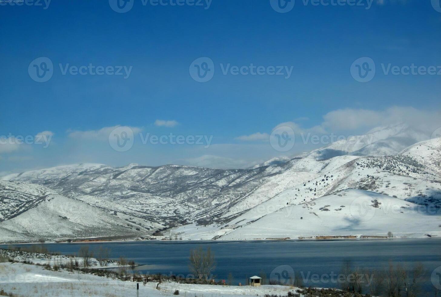 Snow-Capped Mountain Landscape Under a Cloudy Sky photo