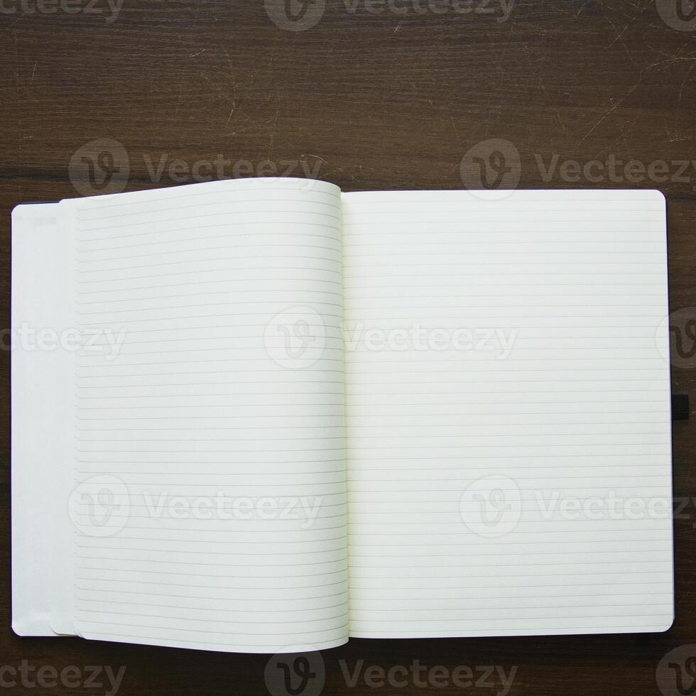 A white notebook with a blank page photo