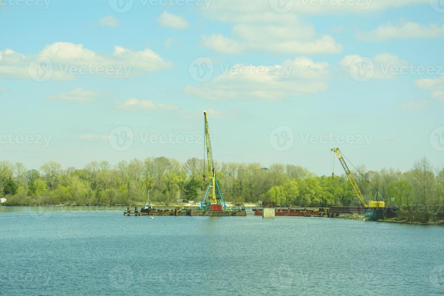 A boat with a crane on it in the water photo