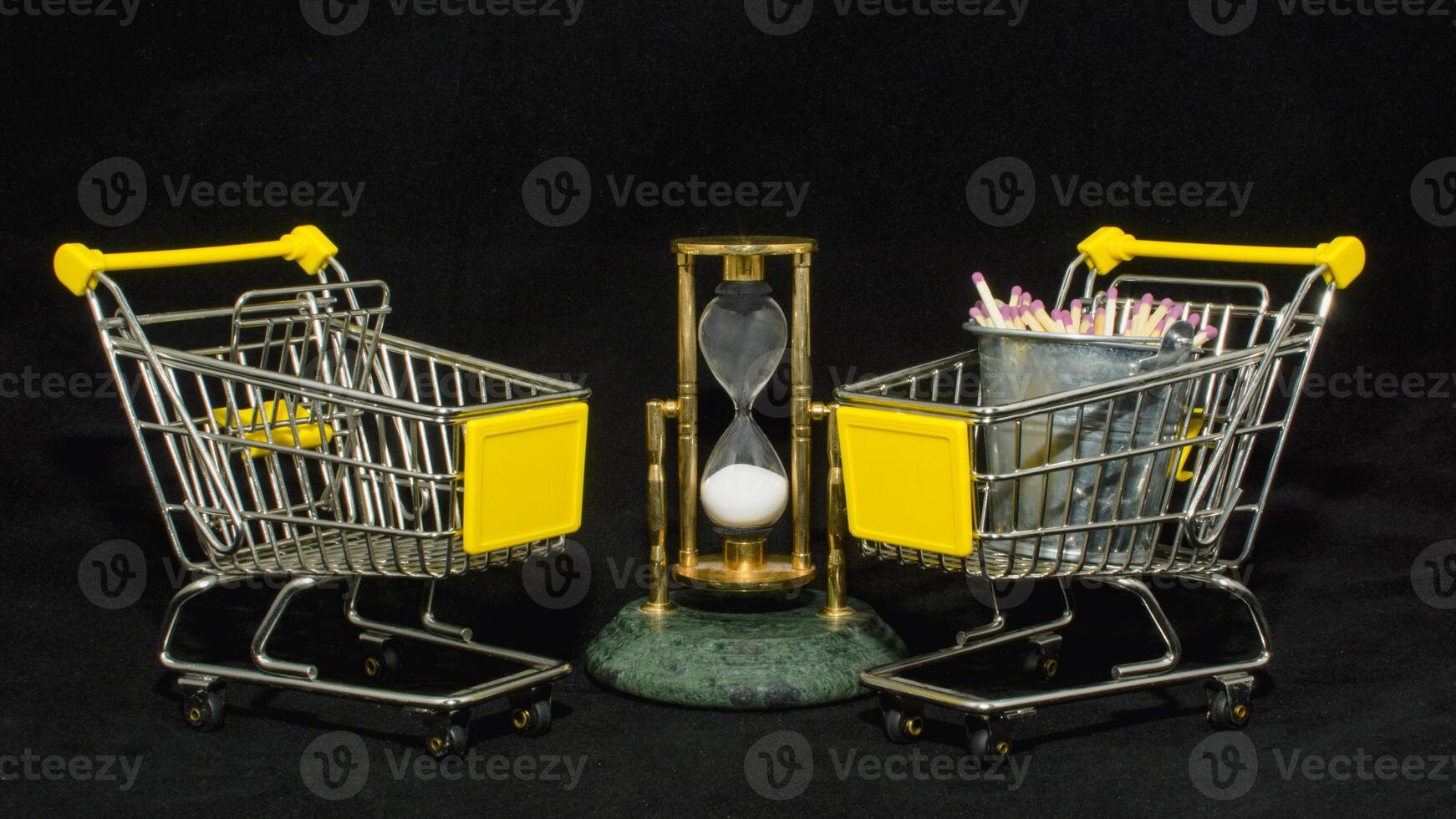 Two shopping carts with a clock and a pencil photo
