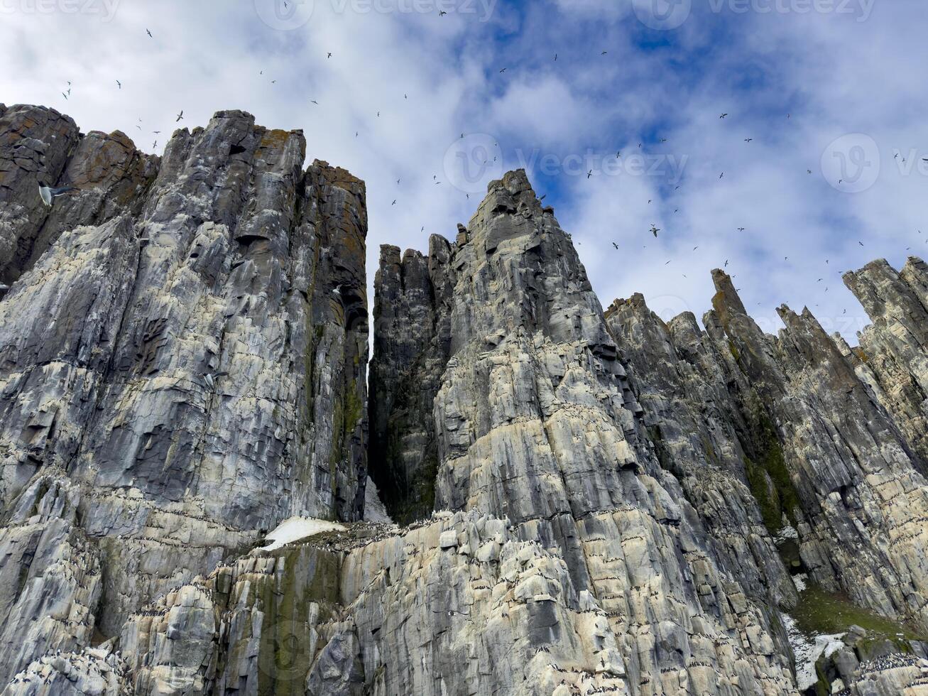 rocks waterfall and glacier at the Alkefjellet between Spitsbergen and Nordaustlandet on Svalbard, Norway photo