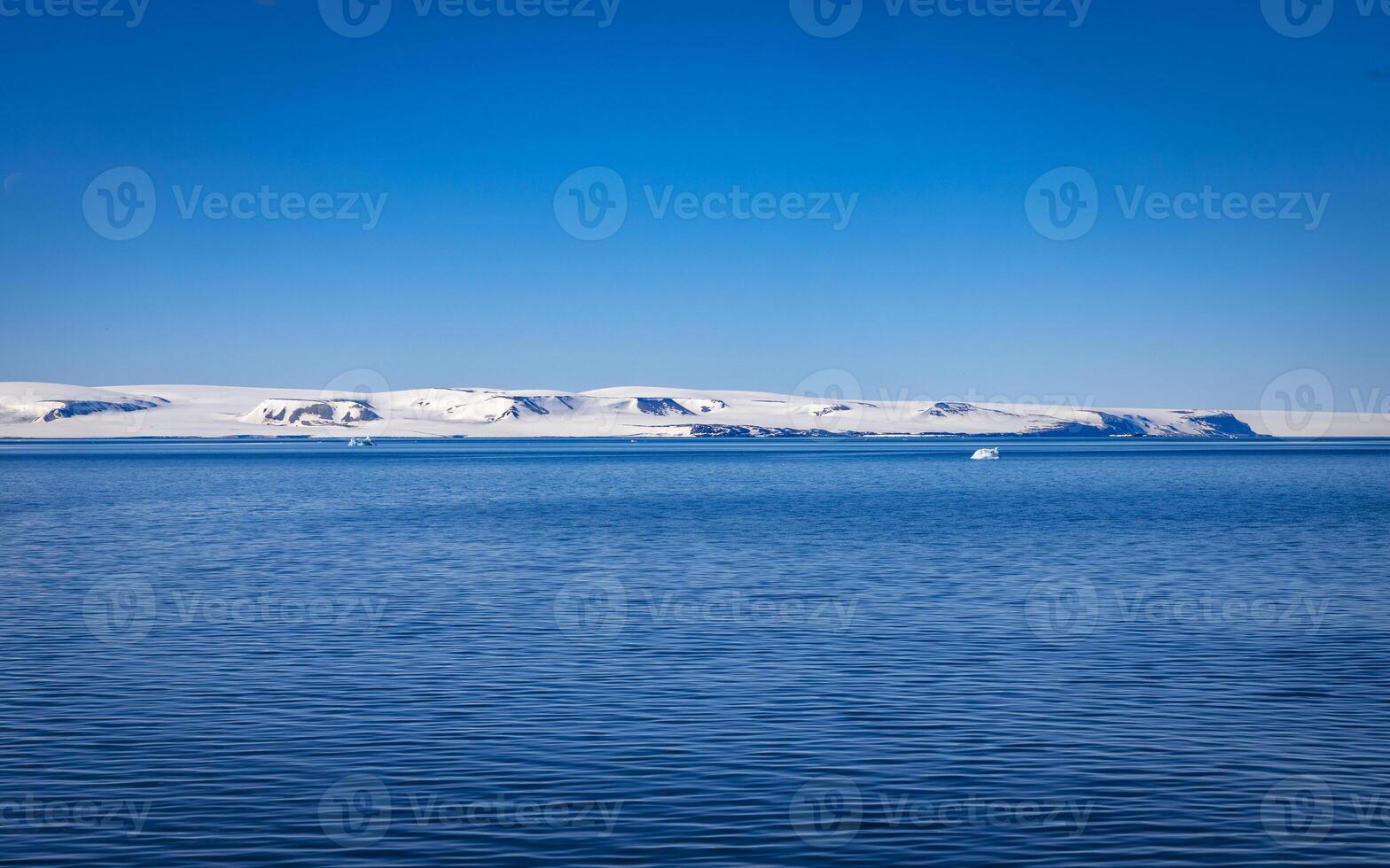 watching a group of walruses in the Arctic at Torellneset on Nordaustlandet on Svalbard, Norway photo