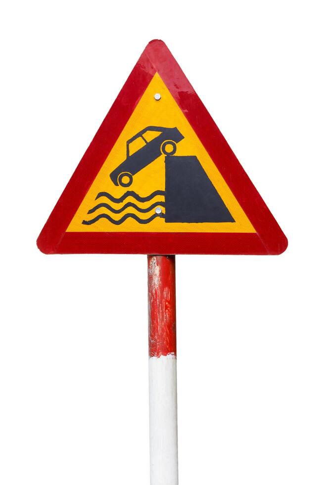 Quayside or river bank. warning road sign on a white background. photo