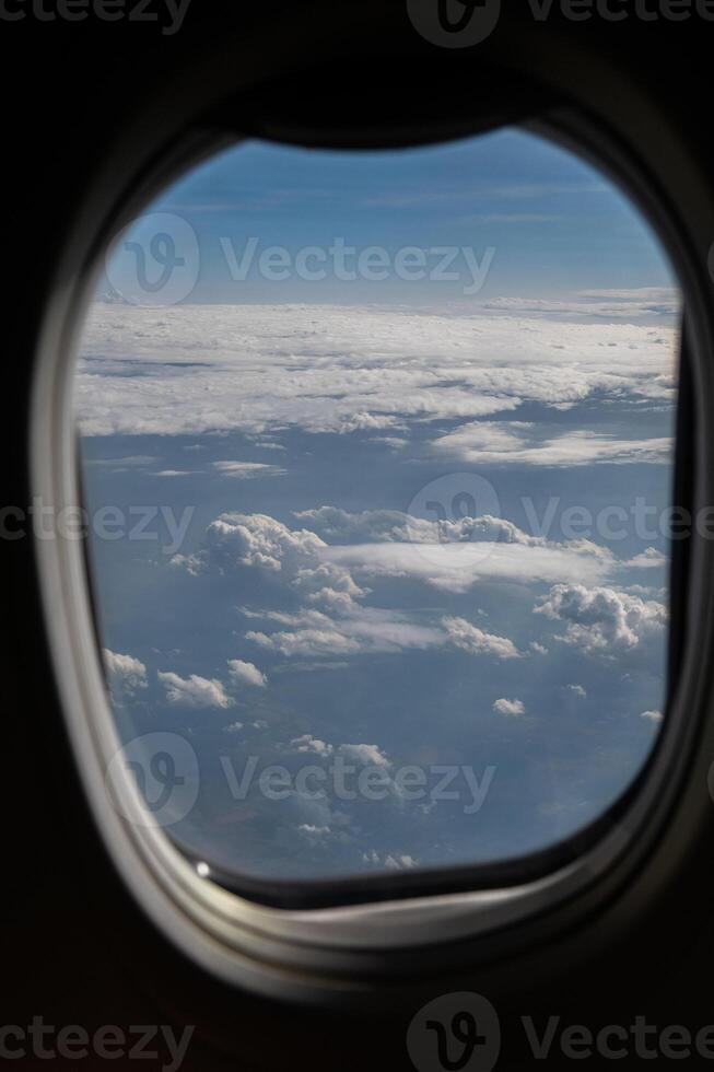 View of clouds and horizon from plane window. photo
