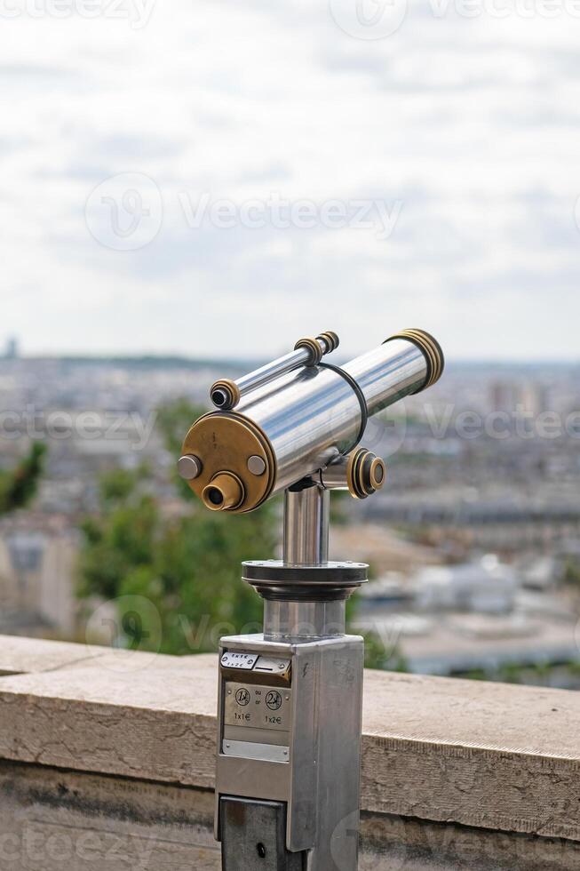 A telescope to watch Paris from Montmartre, France. photo