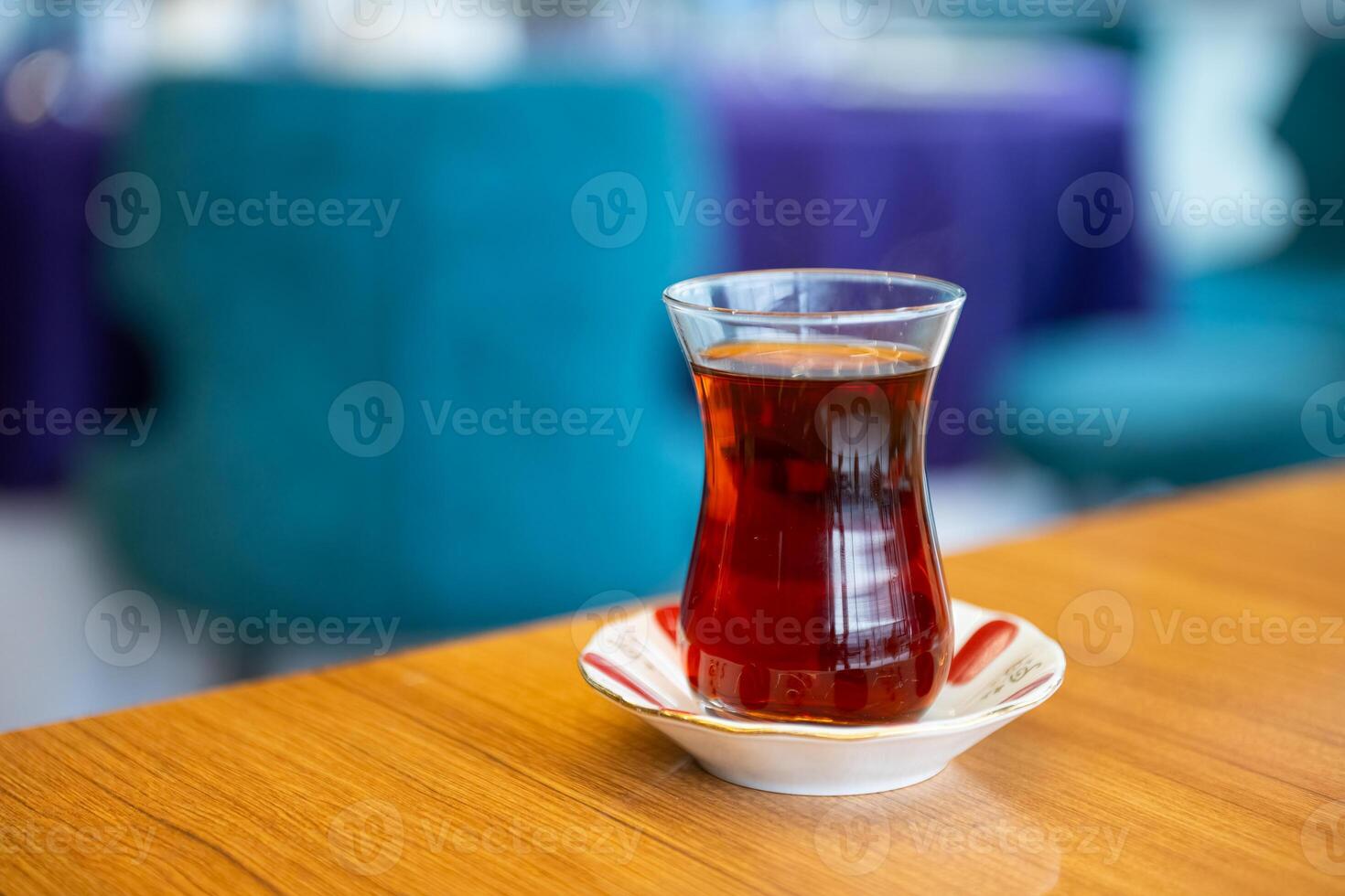 Turkish black tea in a glass cup on the table. photo