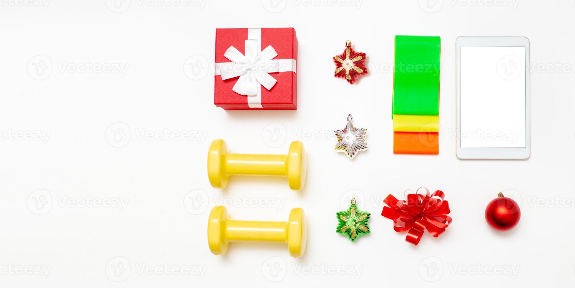 Dumbbells, set of elastic bands, gift box,digital tablet on white background photo
