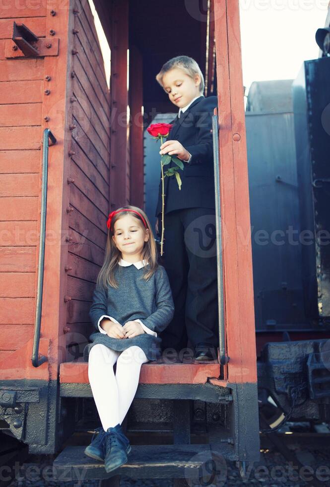 little boy and little girl on the train photo