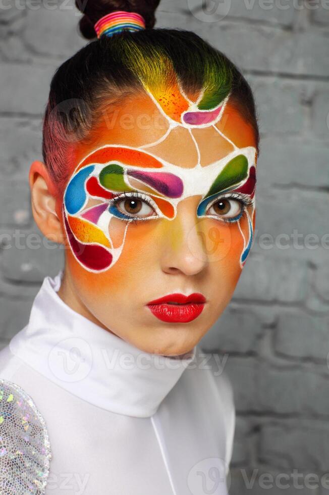 Model with bright creative make up photo